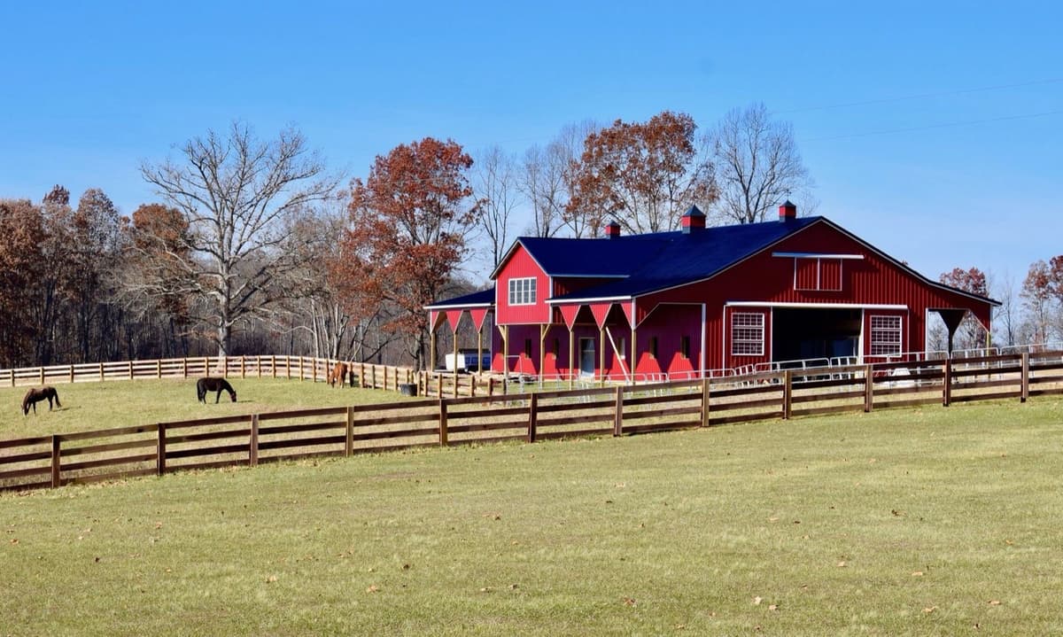 Red horse barn with pasture