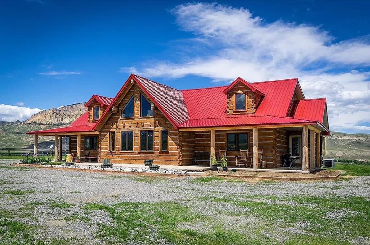 Red ranch building with metal roofing